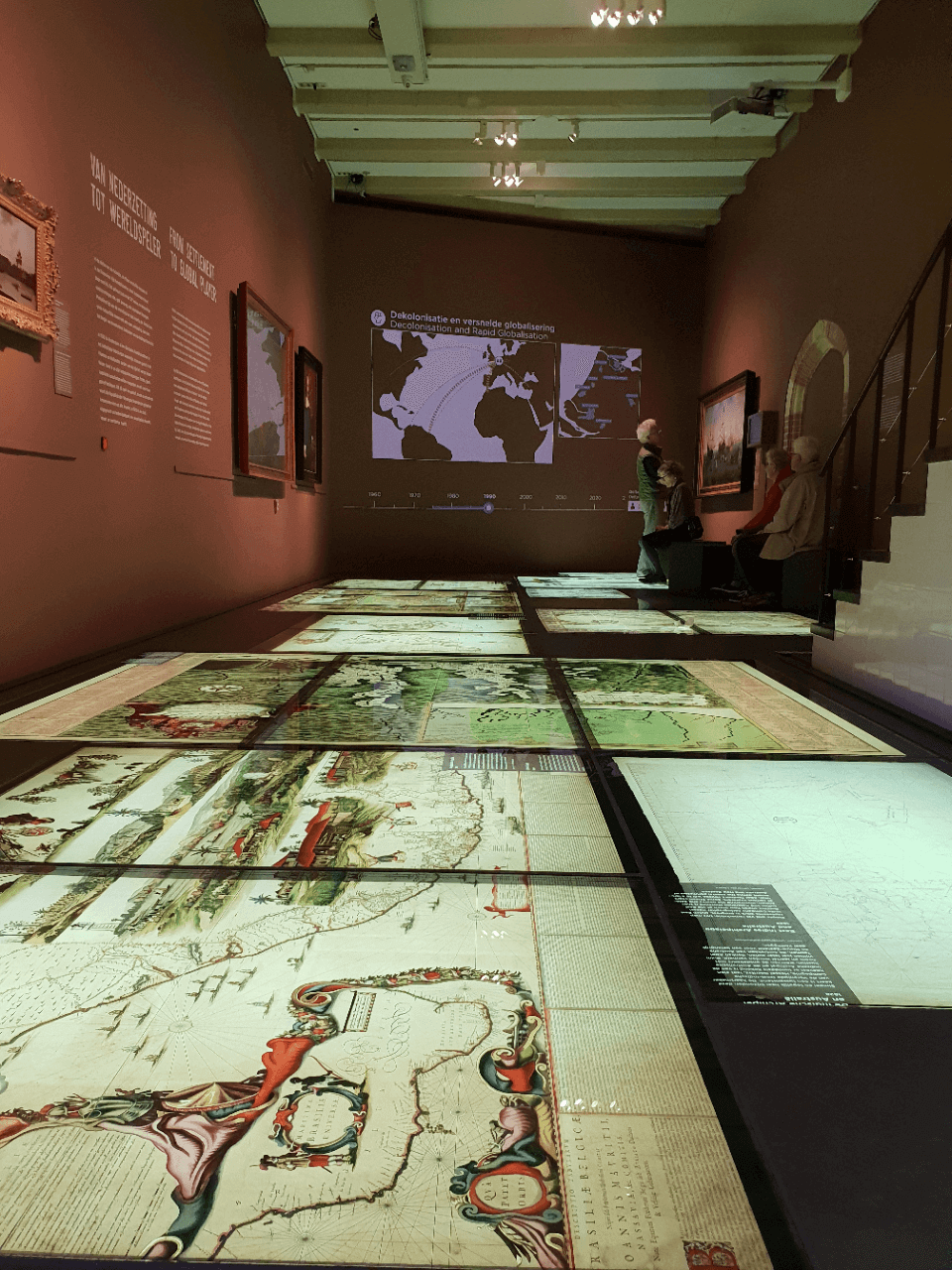 A room filled with historical maps in the Amsterdam Museum. Some of the maps show New York and the borough of Staten Island when it was settled by the Dutch