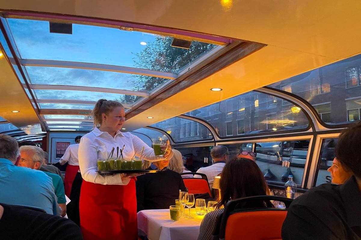 Waitress serving drinks during the Lovers dinnner cruise