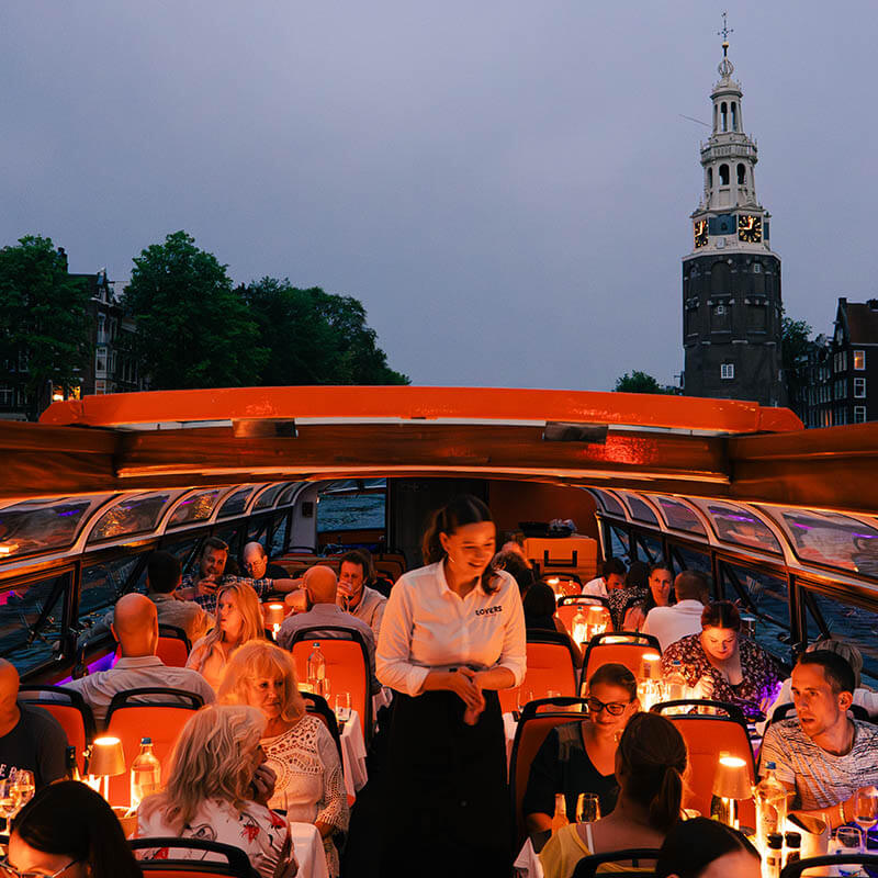 Waitress serving guests on the Lovers Dinner Cruise