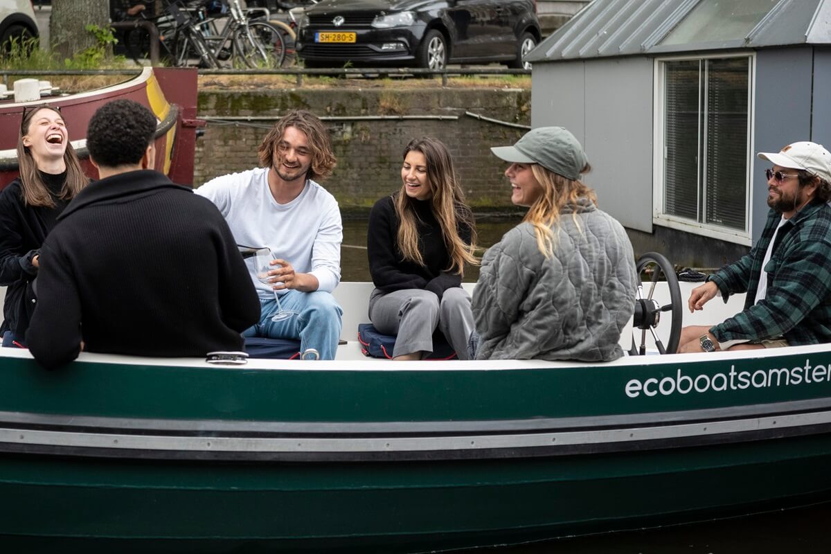 Eco Boats - boat rental - 3 - group having a laugh and a drink on the boat