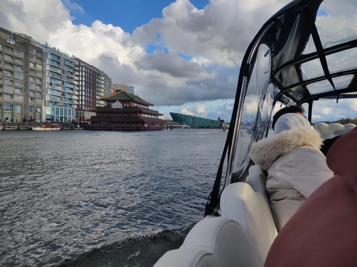 Passing by floating restaurant sea palace and nemo science museum Passing by floating restaurant sea palace and nemo science museum in the Cloud Boat